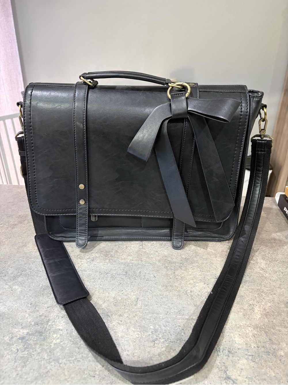 Classic Black Messenger Bag with Bow Accent